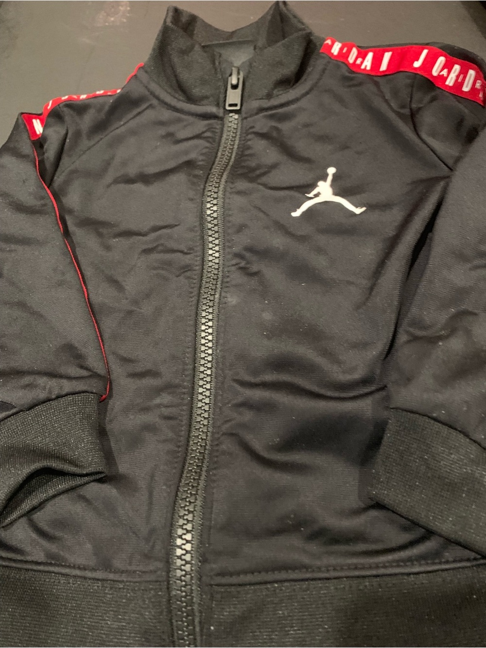 Jordan Black Track Jacket with Red Shoulder Tape and White Jumpman
